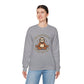 Person wearing a gray sweatshirt with a sloth graphic and text on a white background