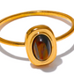 An 18K gold-plated oval natural stone ring with a sleek band.