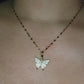 Crystal butterfly pendant necklace in gold plating.