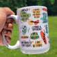 White mug with motivational phrases and colorful illustrations