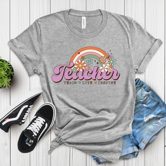 A gray t-shirt with the text 'Teacher. Teach.