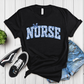Black t-shirt with 'NURSE' printed in blue on a wooden surface with sneakers and shorts.