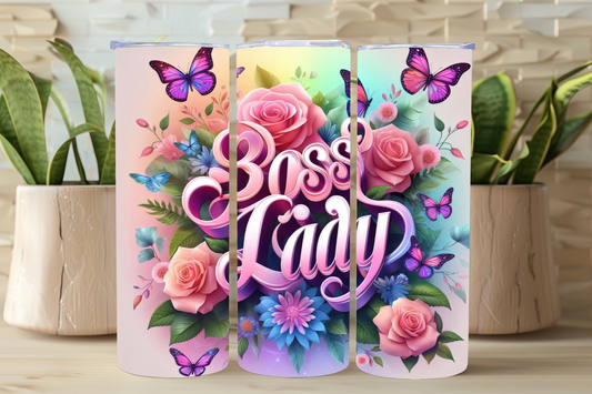A 20oz stainless steel tumbler with a glossy finish, featuring a bold 'Boss Lady' graphic alongside colorful floral designs and butterflies.