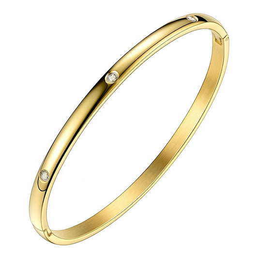 18K gold-plated cuff bracelet with cubic zirconia stones, designed to be worn on the wrist.