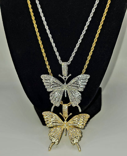 A gold-colored butterfly charm and a silver-colored butterfly charm.