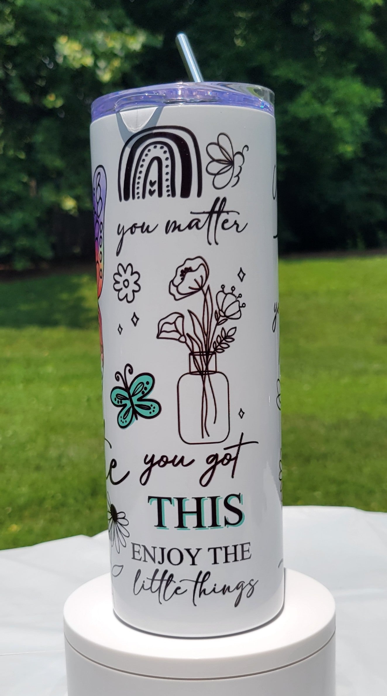 Tumbler with motivational quote and illustrations