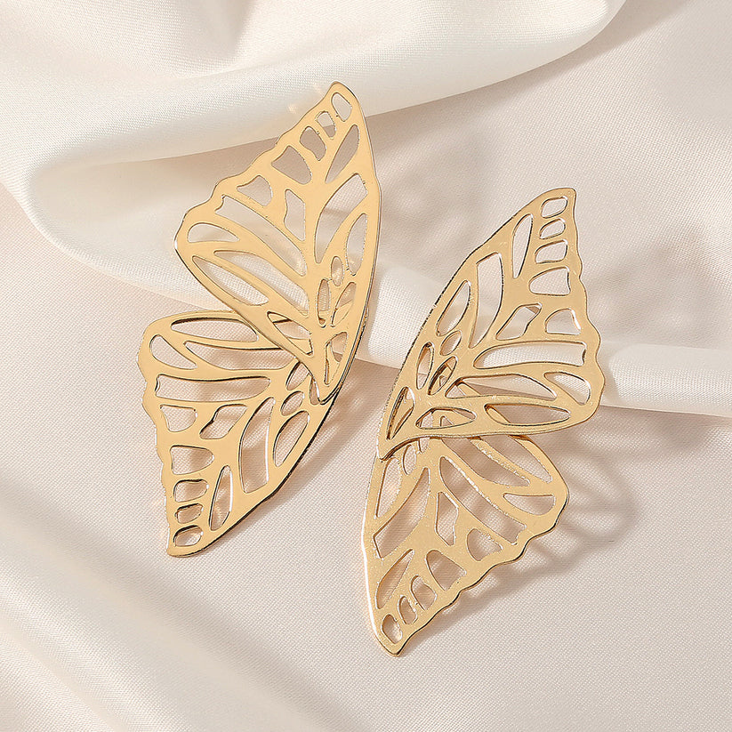 A pair of gold butterfly-shaped earrings.